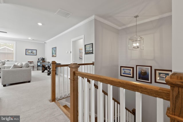 17723 Madaket Way, Lewes, DE 19958 - hallway with an upstairs landing, light colored carpet, a chandelier, ornamental molding, and recessed lighting