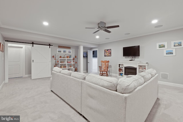 17723 Madaket Way, Lewes, DE 19958 - living room with recessed lighting, light carpet, ceiling fan, a barn door, and crown molding