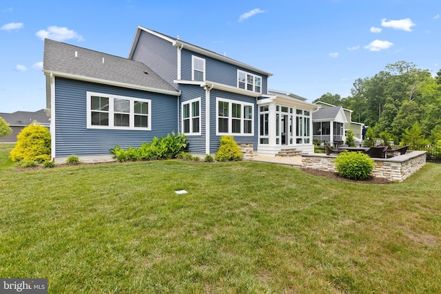 17723 Madaket Way, Lewes, DE 19958 - back of house featuring a sunroom, a patio, and a lawn