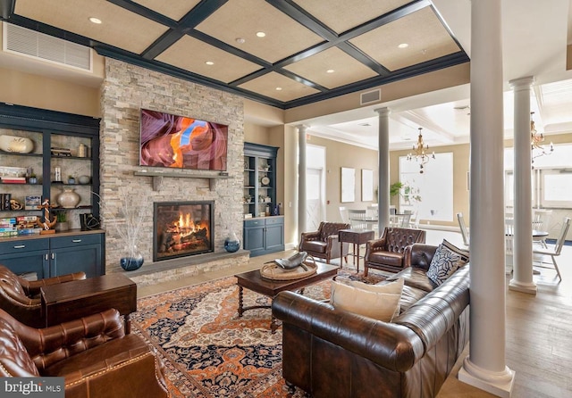 17723 Madaket Way, Lewes, DE 19958 - living area with decorative columns, coffered ceiling, recessed lighting, a stone fireplace, and ornamental molding