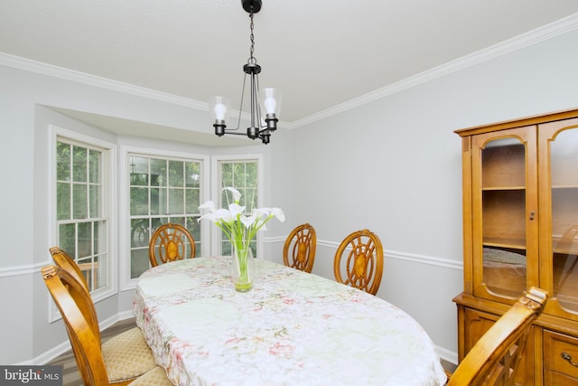 8225 Triple Crown Rd, Bowie, MD 20715 - dining space featuring ornamental molding, a chandelier, healthy amount of natural light, and light wood-style flooring