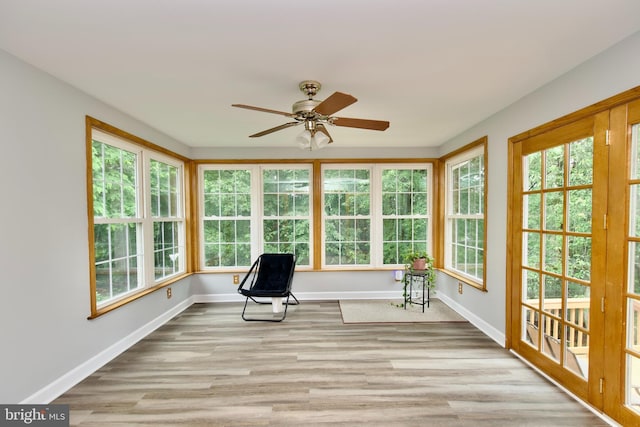 8225 Triple Crown Rd, Bowie, MD 20715 - sunroom / solarium featuring baseboards and wood finished floors