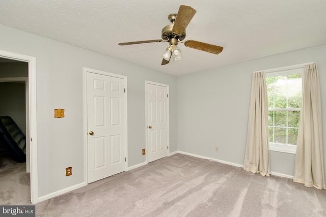 8225 Triple Crown Rd, Bowie, MD 20715 - unfurnished bedroom with carpet floors, a textured ceiling, and ceiling fan