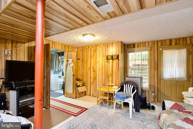 8225 Triple Crown Rd, Bowie, MD 20715 - bedroom with wood walls and washer / clothes dryer