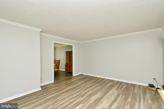 8225 Triple Crown Rd, Bowie, MD 20715 - unfurnished room featuring light wood finished floors, ornamental molding, and a textured ceiling