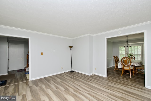 8225 Triple Crown Rd, Bowie, MD 20715 - living room with a chandelier, light wood finished floors, ornamental molding, and a textured ceiling
