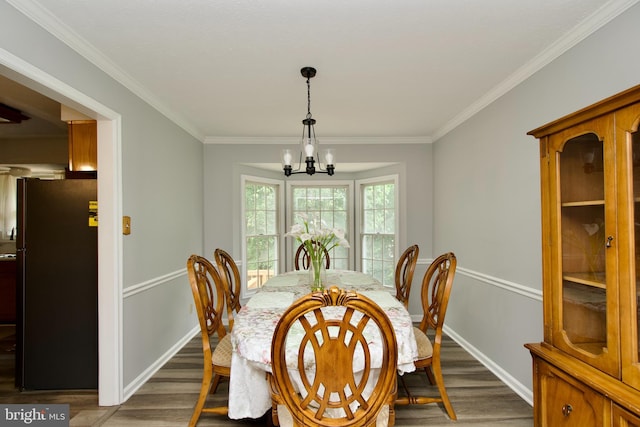 8225 Triple Crown Rd, Bowie, MD 20715 - dining area featuring wood finished floors, a chandelier, and ornamental molding