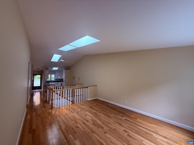 1303 Branchlands Dr, Charlottesville, VA 22901 - bonus room featuring a skylight, wood finished floors, and vaulted ceiling