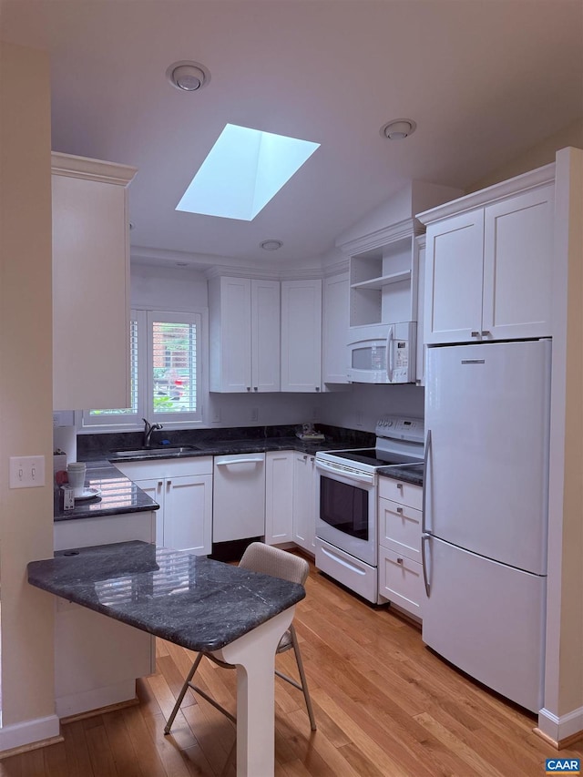 1303 Branchlands Dr, Charlottesville, VA 22901 - kitchen with white appliances, a skylight, white cabinets, open shelves, and light wood-style flooring