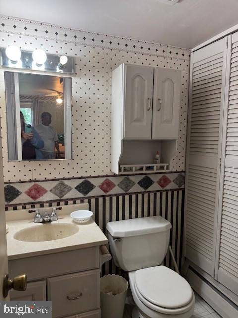 418 Jefferson St, Lansdale, PA 19446 - bathroom featuring a baseboard heating unit, vanity, and a closet