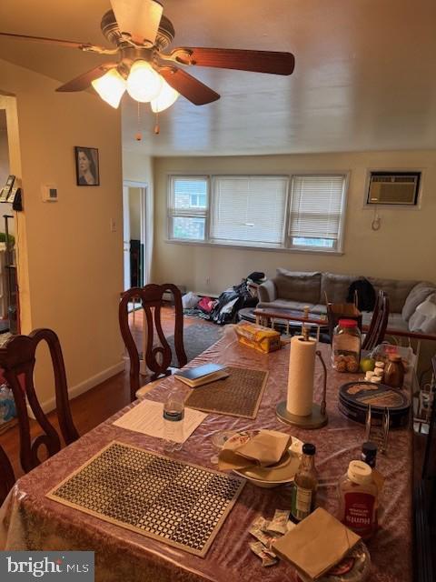 418 Jefferson St, Lansdale, PA 19446 - dining space featuring ceiling fan, a wall unit AC, and wood finished floors