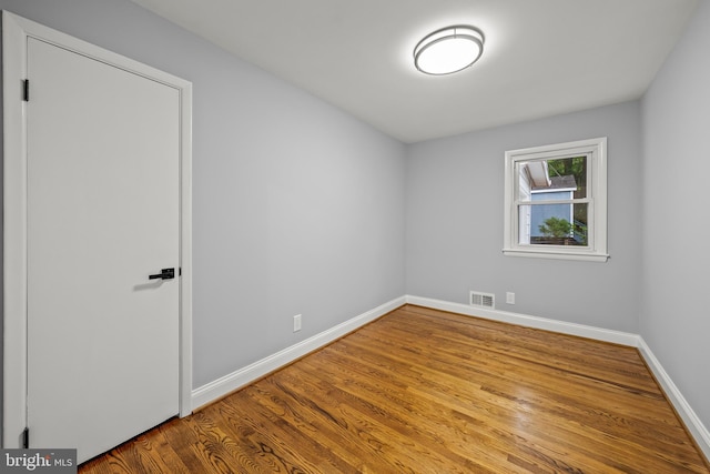 8405 58th Ave, College Park, MD 20740 - spare room with baseboards and wood finished floors