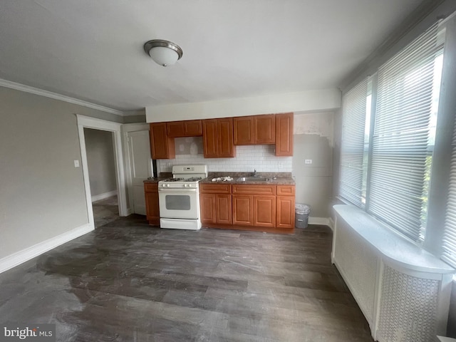 2001 N 52nd St, Philadelphia, PA 19131 - kitchen featuring white gas range oven, crown molding, tasteful backsplash, dark wood-style floors, and brown cabinetry