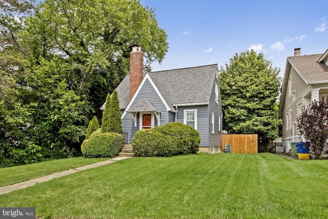5100 Eugene Ave, Baltimore, MD 21206 - view of front of property with roof with shingles and a chimney