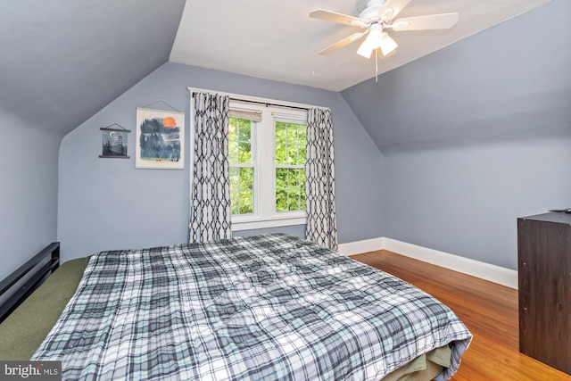 5100 Eugene Ave, Baltimore, MD 21206 - bedroom with vaulted ceiling, wood finished floors, a ceiling fan, and a baseboard heating unit