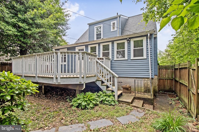5100 Eugene Ave, Baltimore, MD 21206 - rear view of house featuring a deck, a fenced backyard, and a shingled roof