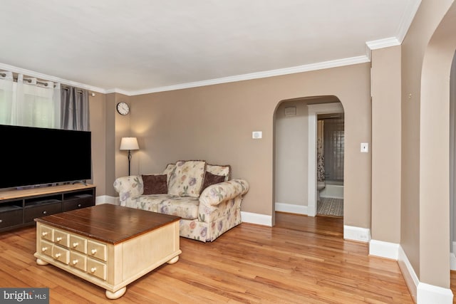 5100 Eugene Ave, Baltimore, MD 21206 - living area with arched walkways, crown molding, and light wood finished floors