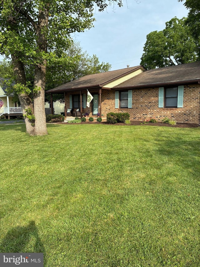 817 Maple Ave, Waynesboro, VA 22980 - view of front facade with brick siding, a front lawn, and a shingled roof