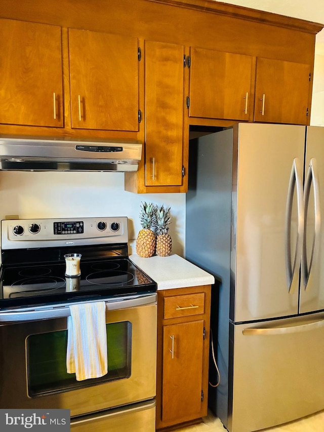 817 Maple Ave, Waynesboro, VA 22980 - kitchen featuring appliances with stainless steel finishes, ventilation hood, light countertops, and brown cabinetry