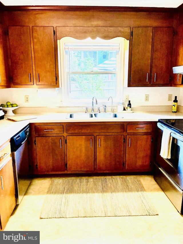 817 Maple Ave, Waynesboro, VA 22980 - kitchen featuring stainless steel appliances, light countertops, and brown cabinetry