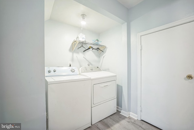 15198 Wentwood Ln, Woodbridge, VA 22191 - laundry room with washing machine and dryer and light wood-style flooring