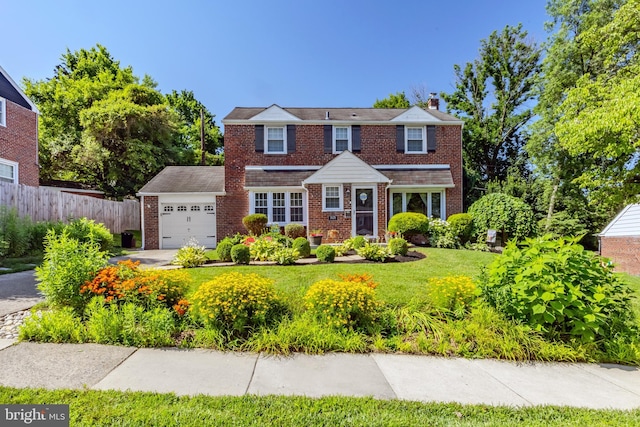 1626 Rose Glen Rd, Havertown, PA 19083 - view of front facade with a chimney, a garage, and brick siding