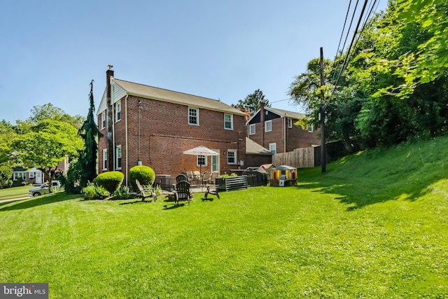 1626 Rose Glen Rd, Havertown, PA 19083 - rear view of house with brick siding and a chimney