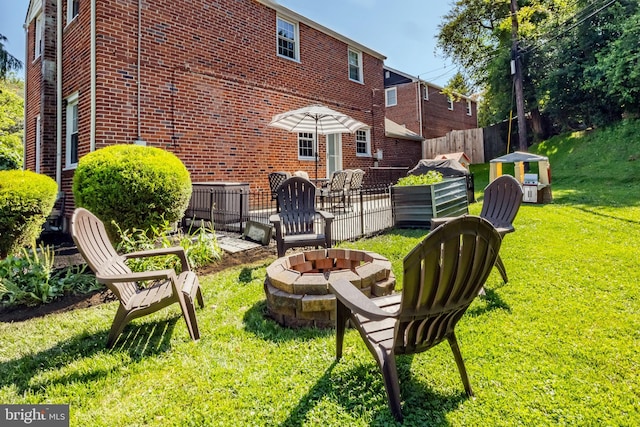 1626 Rose Glen Rd, Havertown, PA 19083 - rear view of house with a fire pit and brick siding