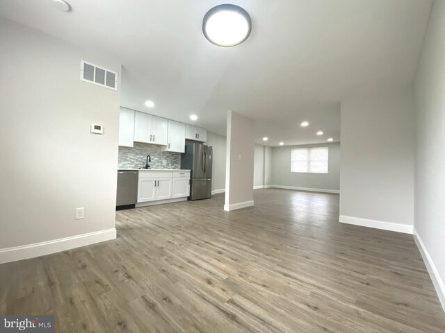 1319 Rainer Rd, Brookhaven, PA 19015 - unfurnished living room featuring recessed lighting and light wood-type flooring
