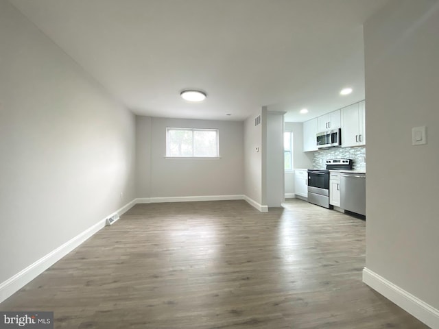 1319 Rainer Rd, Brookhaven, PA 19015 - unfurnished living room featuring wood finished floors and recessed lighting