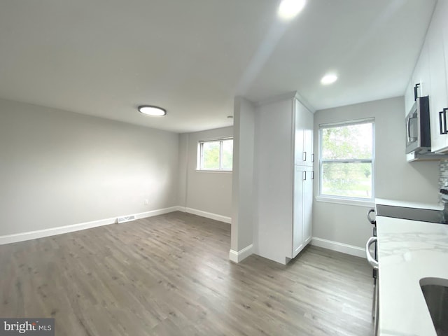 1319 Rainer Rd, Brookhaven, PA 19015 - unfurnished dining area with wood finished floors and baseboards