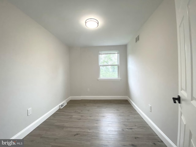 1319 Rainer Rd, Brookhaven, PA 19015 - empty room with baseboards and wood finished floors