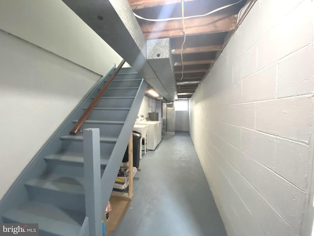 1319 Rainer Rd, Brookhaven, PA 19015 - staircase with finished concrete floors, separate washer and dryer, and concrete block wall