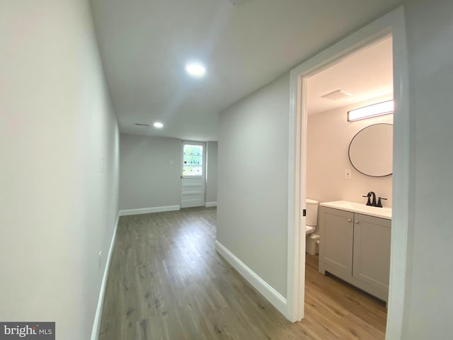 1319 Rainer Rd, Brookhaven, PA 19015 - hallway featuring light wood finished floors and recessed lighting
