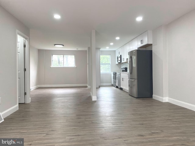 1319 Rainer Rd, Brookhaven, PA 19015 - kitchen featuring appliances with stainless steel finishes, open floor plan, white cabinets, recessed lighting, and wood finished floors