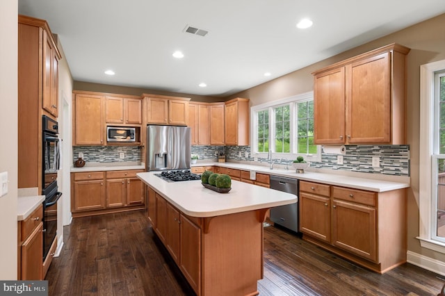 12773 Beebe Ct, Lovettsville, VA 20180 - kitchen featuring stainless steel appliances, light countertops, tasteful backsplash, dark wood-style flooring, and recessed lighting
