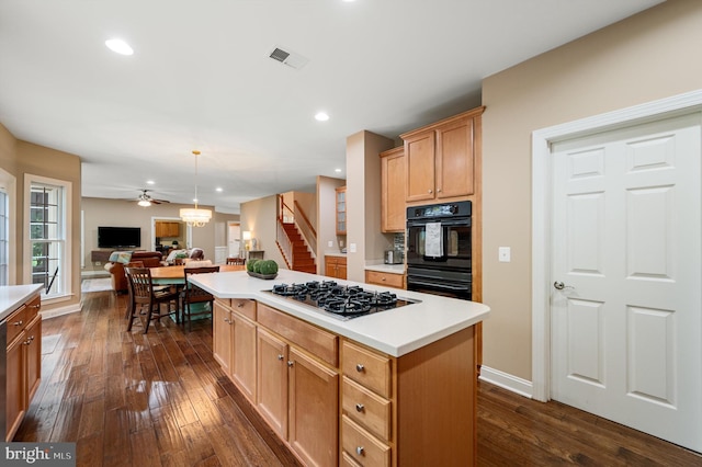 12773 Beebe Ct, Lovettsville, VA 20180 - kitchen with gas cooktop, open floor plan, dark wood-type flooring, ceiling fan, and light countertops