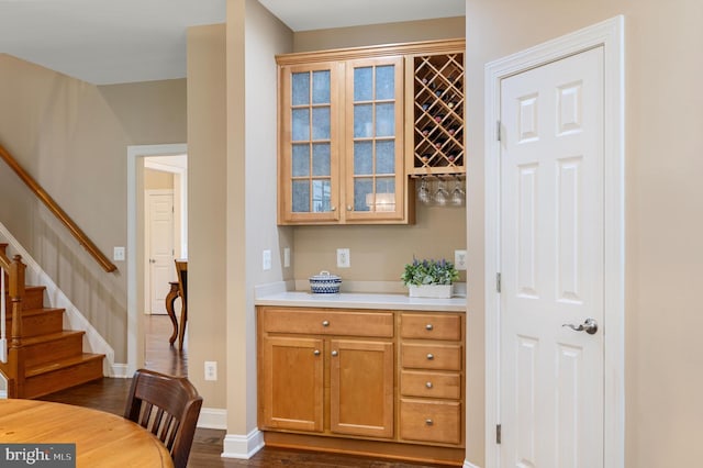 12773 Beebe Ct, Lovettsville, VA 20180 - bar area featuring stairway and dark wood-type flooring