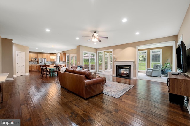 12773 Beebe Ct, Lovettsville, VA 20180 - living room with dark wood-type flooring, ceiling fan, a glass covered fireplace, and recessed lighting