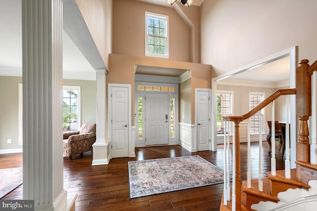 12773 Beebe Ct, Lovettsville, VA 20180 - foyer with stairway, ornate columns, dark wood-style floors, plenty of natural light, and ornamental molding