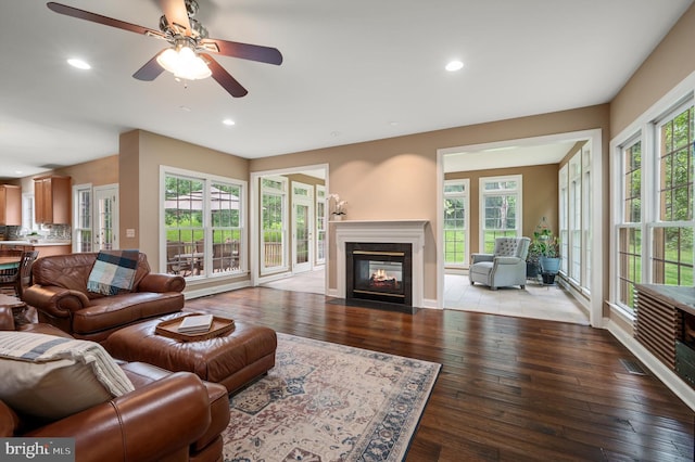 12773 Beebe Ct, Lovettsville, VA 20180 - living area with a fireplace with flush hearth, wood-type flooring, recessed lighting, and a ceiling fan
