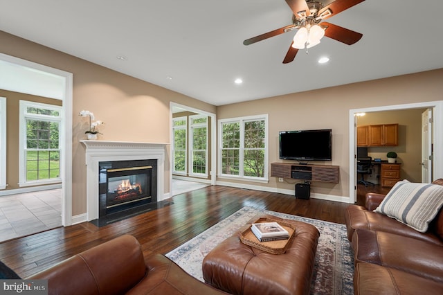 12773 Beebe Ct, Lovettsville, VA 20180 - living room with a fireplace with flush hearth, wood finished floors, a ceiling fan, recessed lighting, and an office area