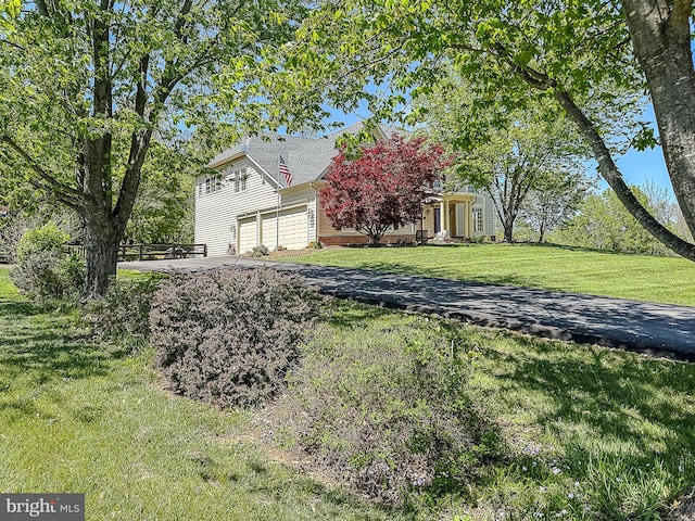 12773 Beebe Ct, Lovettsville, VA 20180 - view of home's exterior with a garage, driveway, and a yard