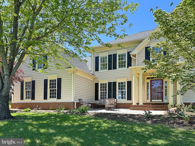 12773 Beebe Ct, Lovettsville, VA 20180 - view of front of house with a front lawn, outdoor lounge area, and brick siding