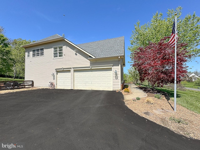 12773 Beebe Ct, Lovettsville, VA 20180 - view of side of property featuring a garage, a shingled roof, and driveway