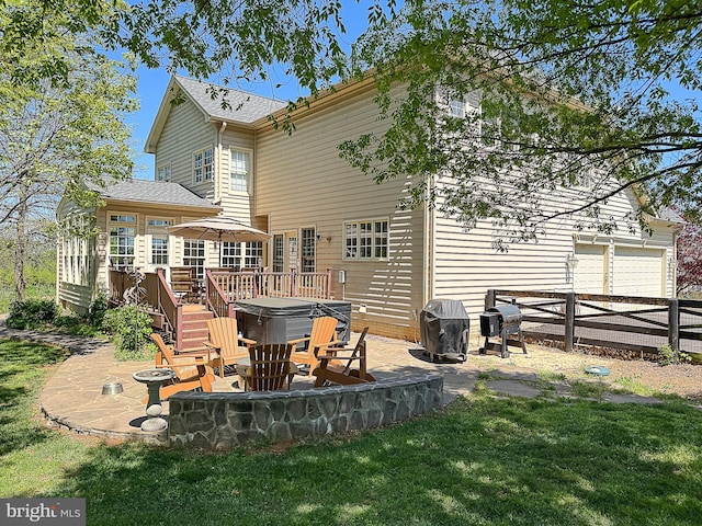 12773 Beebe Ct, Lovettsville, VA 20180 - back of property with a hot tub, a patio area, a garage, and a wooden deck