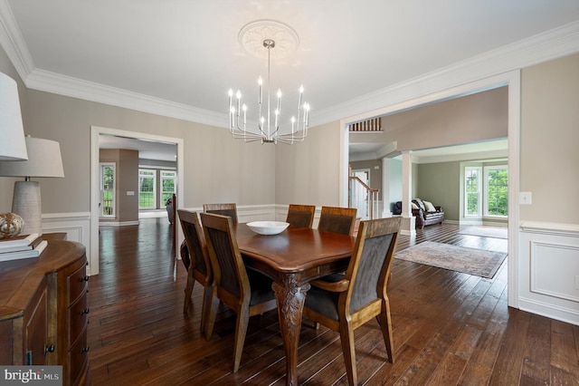 12773 Beebe Ct, Lovettsville, VA 20180 - dining room with plenty of natural light, dark wood-style floors, a chandelier, a wainscoted wall, and crown molding