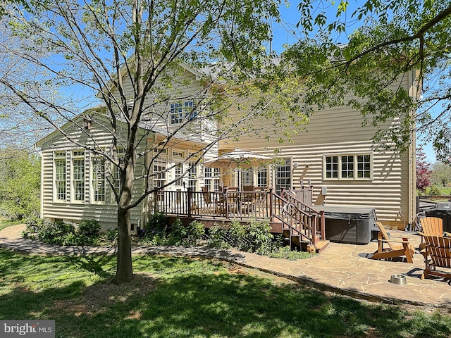 12773 Beebe Ct, Lovettsville, VA 20180 - back of house featuring a hot tub, a deck, a patio area, and a lawn