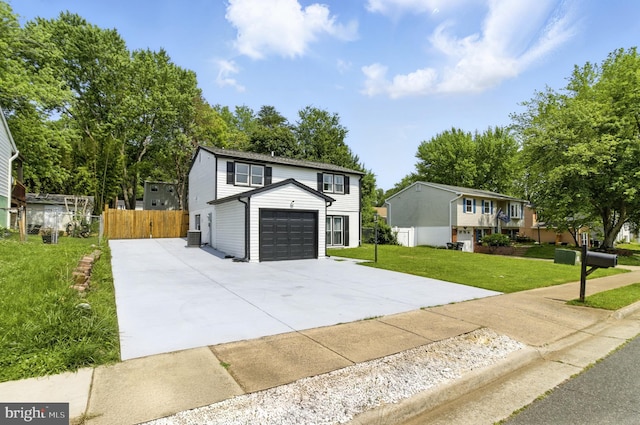 13727 Mahoney Dr, Woodbridge, VA 22193 - traditional home featuring concrete driveway and an attached garage