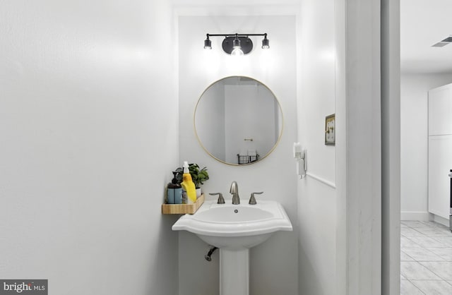 13727 Mahoney Dr, Woodbridge, VA 22193 - bathroom featuring marble look tiles